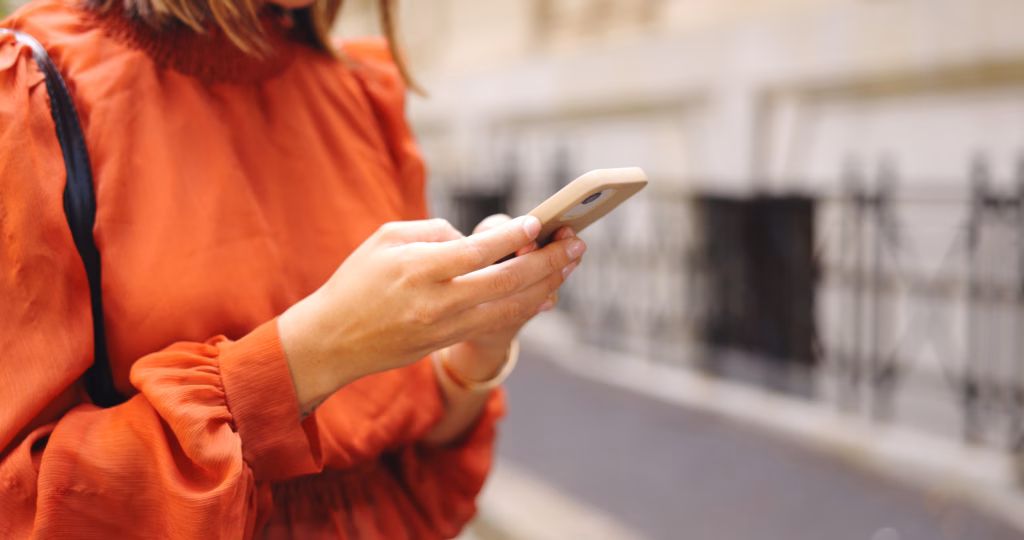 The Message-Driven Approach in Content Marketing 2 hands typing on the phone